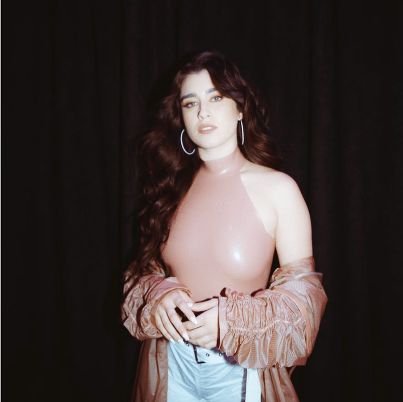 Lauren Jauregui wearing tight rubber top